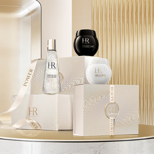 Soins de luxe et coffrets cadeaux HR sur fond studio en metal dore cannele.​
